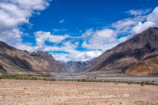 Wide panorama of Nubra Valley with mountains and riverbed in Ladakh