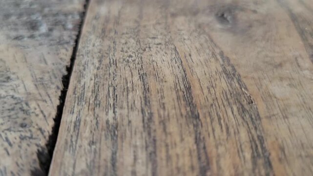 Close-up of weathered wooden planks texture with visible grain
