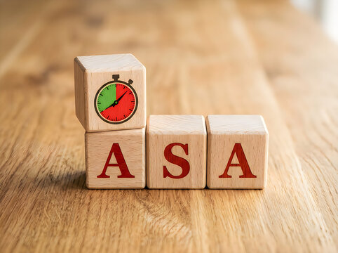 Wooden blocks with ASA letters and stopwatch timer on top  business concept