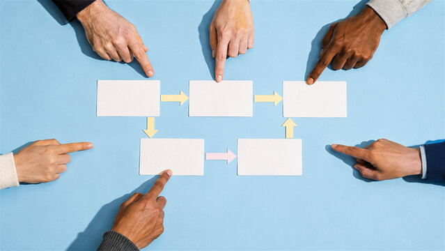 diverse group of people pointing at empty flowchart boxes on blue background. Collaborative business process planning and team strategy development. Concept of teamwork and decision making