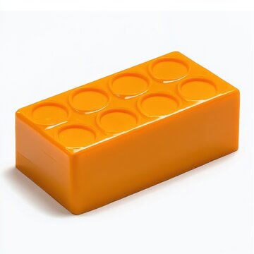 bright orange glossy toy building brick with eight studs on white background, playful and cheerful