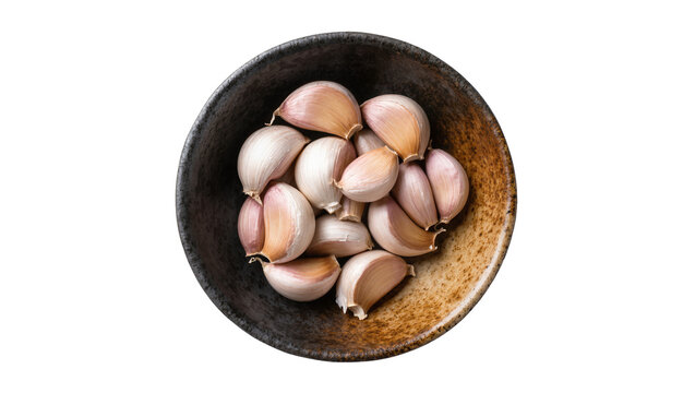 Isolated Rustic ceramic bowl filled with raw garlic cloves, essential ingredient for culinary.