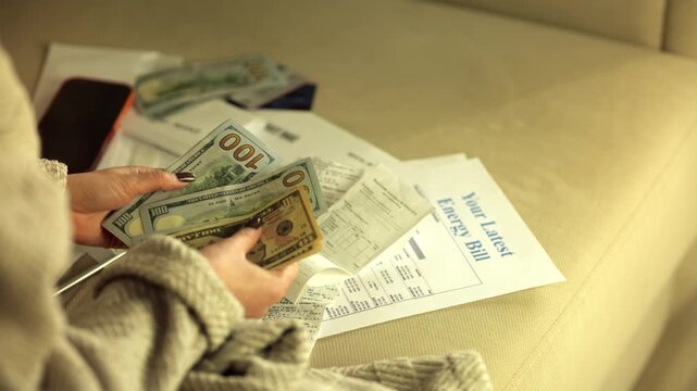 Person Counting US Dollar Money To Pay Energy Bill. Utility Expenses. Budget Planning 
