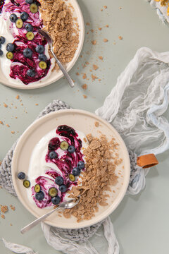 Healthy yogurt bowls with fresh blueberries and crunchy cereal topping