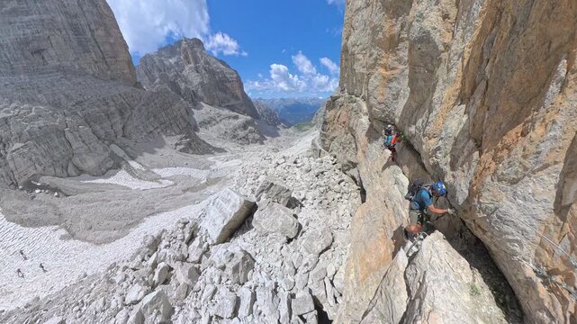 Climbers starting the Via Ferrata Bocchette Centrali at Bocca di Brenta, Brenta Dolomites, Italy