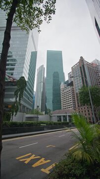 Vibrant Market Street downtown in Singapore with modern office skyscrapers financial centers and corporate buildings defining the urban skyline of Asia