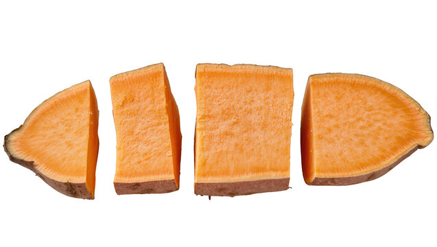 Isolated sweet potato pieces, cut and arranged in a row, fresh raw orange vegetable