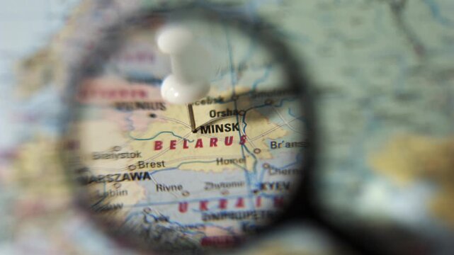 Find Minsk on a world map using a magnifying glass