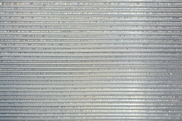 Krople rosy na poliwęglanie komorowym, dew drops on cellular polycarbonate, Striped carbonate with drops of dew on a sunny day. transparent roof. Bottom view. © kateej