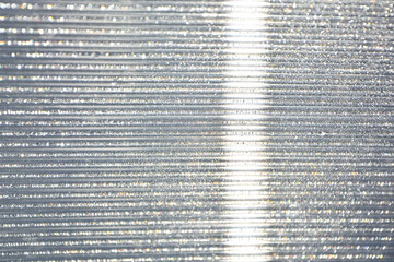 Krople rosy na poliwęglanie komorowym, dew drops on cellular polycarbonate, Striped carbonate with drops of dew on a sunny day. transparent roof. Bottom view. © kateej
