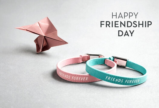 Happy friendship day celebration with origami paper airplane and friendship bracelets on table
