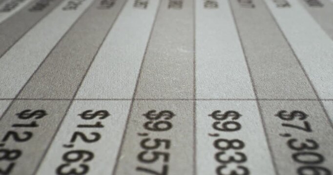 Close-up of printed numbers with smooth camera glide across the page