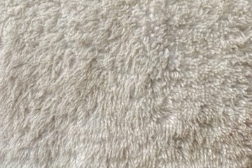 Close-up of soft white terry towel fabric with detailed loop texture, ideal as a clean textile background for hygiene, bathroom, spa, laundry, and home interior concepts. © Derypahlawans