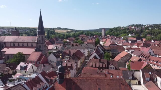 aerial view of the old town M&uuml;nnerstadt in the Rh&ouml;n Region of Lower Franconia, Bavaria, Germany 4k