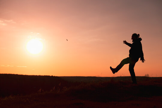Striding Silhouette Against the Blazing Sunset Sun