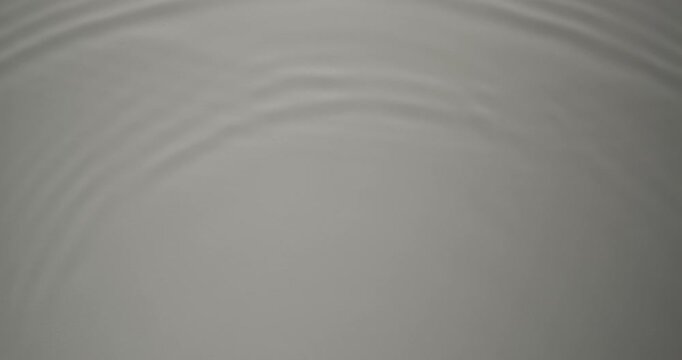 Concentric circles spread out on calm water. Minimal waves move slowly across a smooth surface. The composition embodies purity and stillness. Can be used as overlay elements for design projects. 