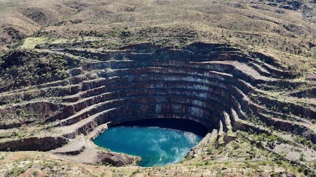 Aerial View of the Abandoned Mary Kathleen Uranium Mine Open Pit with Vibrant Blue Water, Outback Queensland Australia
