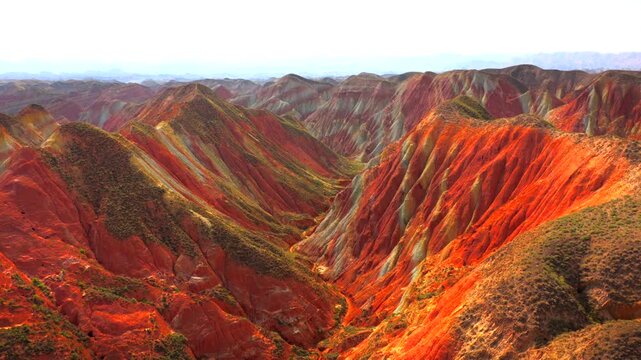 Aerial view of colorful stratified Danxia landforms in Gansu, natural geological landscape
Rainbow layered rock hills formed by millions of years of erosion and tectonic movement
