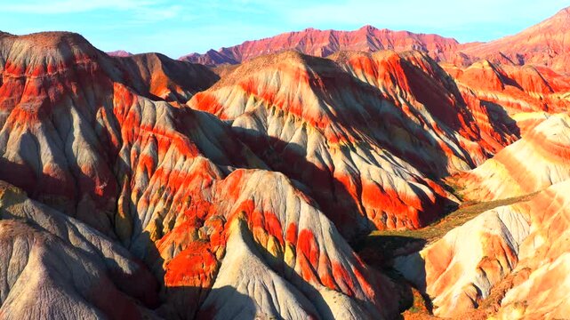 Aerial view of colorful stratified Danxia landforms in Gansu, natural geological landscape
Rainbow layered rock hills formed by millions of years of erosion and tectonic movement