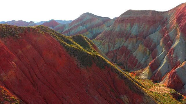 Aerial view of colorful stratified Danxia landforms in Gansu, natural geological landscape
Rainbow layered rock hills formed by millions of years of erosion and tectonic movement