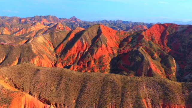 Aerial view of colorful stratified Danxia landforms in Gansu, natural geological landscape
Rainbow layered rock hills formed by millions of years of erosion and tectonic movement