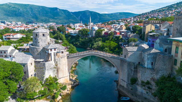 Top down aerial drone view of the historic Stari Most Mostar Old Bridge over Neretva river in Bosnia and Herzegovina