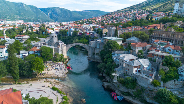 Top down aerial drone view of the historic Stari Most Mostar Old Bridge over Neretva river in Bosnia and Herzegovina