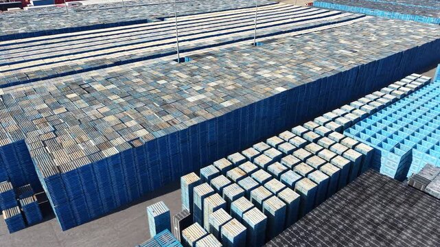 Aerial view of blue plastic recycling crates stored outdoors