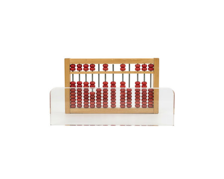 The abacus sits on a white surface, displaying red beads in a mathematical arrangement.