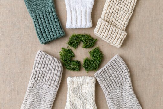 The Knitted Gloves Circle Embracing Green Recycling Theme on Kraft Paper
