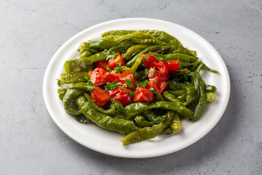 Traditional Turkish fried green peppers with tomatoes and olive oil