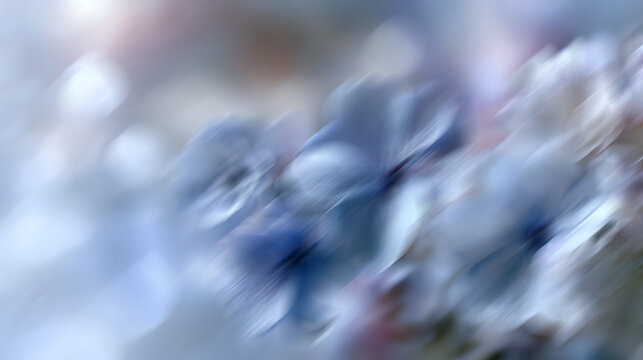 Abstract blue floral shapes softly blurring across the frame, creating a conceptual image of gentle movement and a peaceful atmosphere