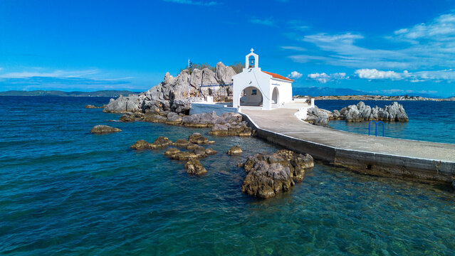 Aerial view of the chapel of Agios Isidoros on a rocky islet in Chios island Greece