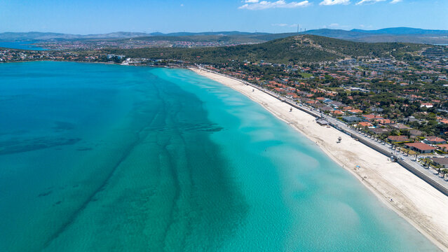 Aerial view of the long white sand beach and turquoise sea in Ilica Cesme Izmir Turkey