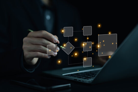 A business designs digital project diagrams on a laptop. Creating automated business process maps. Concepts include process management, algorithmic flow systems, and workflow planning