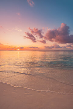 Dreamy pastel sunset beach, calm tropical sea, soft glowing sky. Beautiful tranquil nature seascape, peaceful relaxing evening shore. Meditation wellbeing background, serene nature wallpaper design
