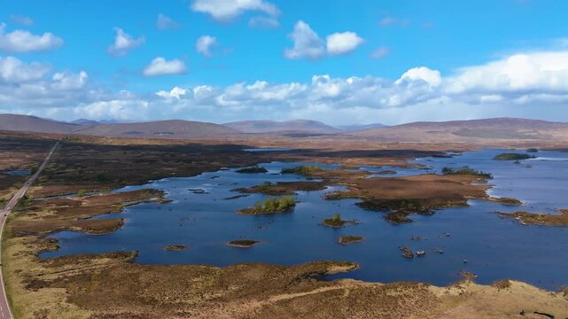 Scotland, Rannoch Moor, Loch Ba,  drone flight over mountain lake surrounded by Scottish Highlands