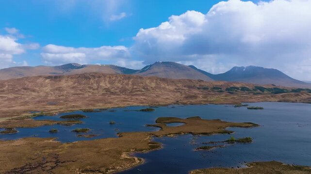 Scotland, Loch Ba, Rannoch Moor, drone flight over mountain lake surrounded by Scottish Highlands