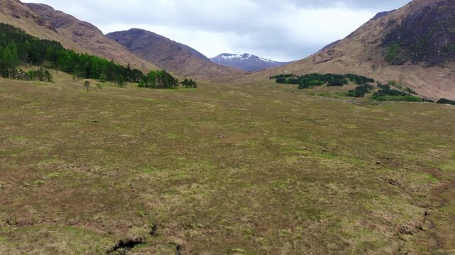 Scotland, Glen Etive, Skyfall Valley, drone flight towards dramatic Highland mountains