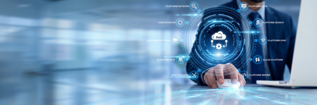Businessman using a laptop for Paas data analysis, monitoring cloud platform hosting resource metrics, tracking developer software environment performance, optimizing scalable web application testing.