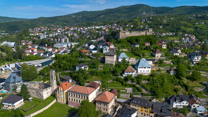 Fototapeta premium Drone view of St Luke belfry with ruined church and Jajce fortress on the hill