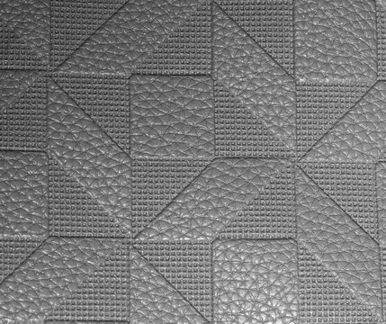 Abstract Synthetic Leather Surface with Grid and Square Relief Details