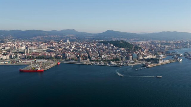 Aerial Drone View of Passenger Ferries Navigating the Ria de Vigo Estuary at Sunset After Departing the Cies Islands