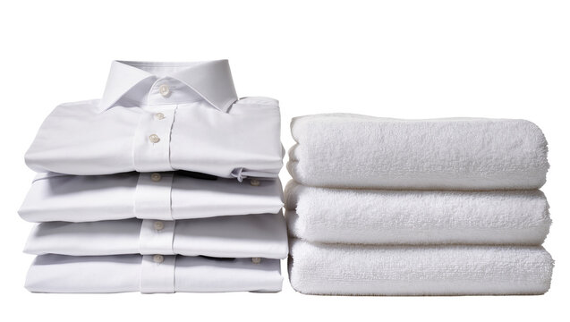 Isolated stack of neatly folded clean white dress shirts and fluffy towels ready for use