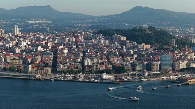 Aerial Drone View of Passenger Ferries Navigating the Ria de Vigo Estuary at Sunset After Departing the Cies Islands