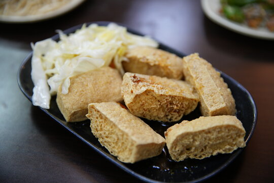 Taiwanese traditional stinky tofu served with pickled cabbage.