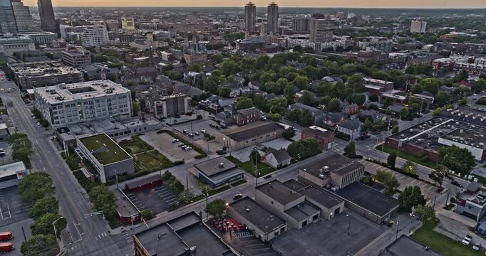 Indianapolis Indiana Aerial v21 cinematic tilt up reveal from Lockerbie Square to show the metropolitan city blocks against a dramatic sunset - Shot with Inspire 2, X7 camera - August 2020
