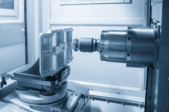 Horizontal CNC milling machine operation performing a rough cut on aluminum parts with an indexable tool.