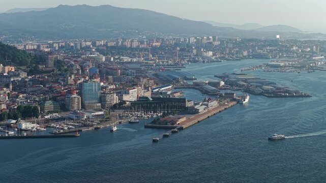 Aerial Drone View of Passenger Ferries Navigating the Ria de Vigo Estuary at Sunset After Departing the Cies Islands