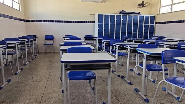 Empty classroom with school desks in a public school